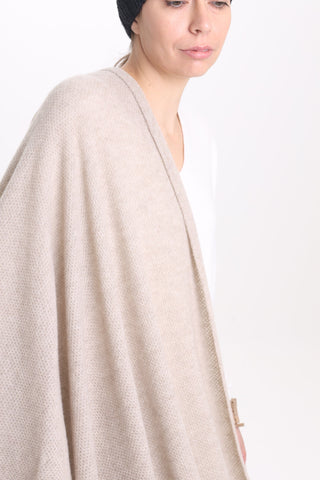 The Key Tō Dean’s Stola cape is handwoven from a pure cashmere knit. Arriving in a versatile sand hue, it’s an amazing addition to any evening gown, a wedding dress, jeans & jumper.